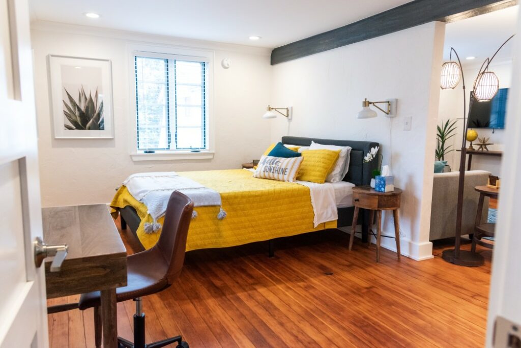 airbnb bedroom with yellow bedspread