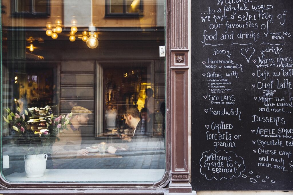 people eating in restaurant after restaurant window cleaning